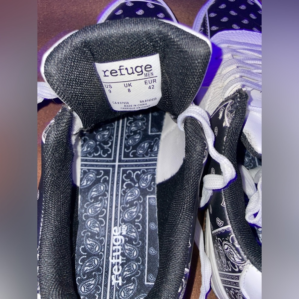 Pair of white shoes with bandana print